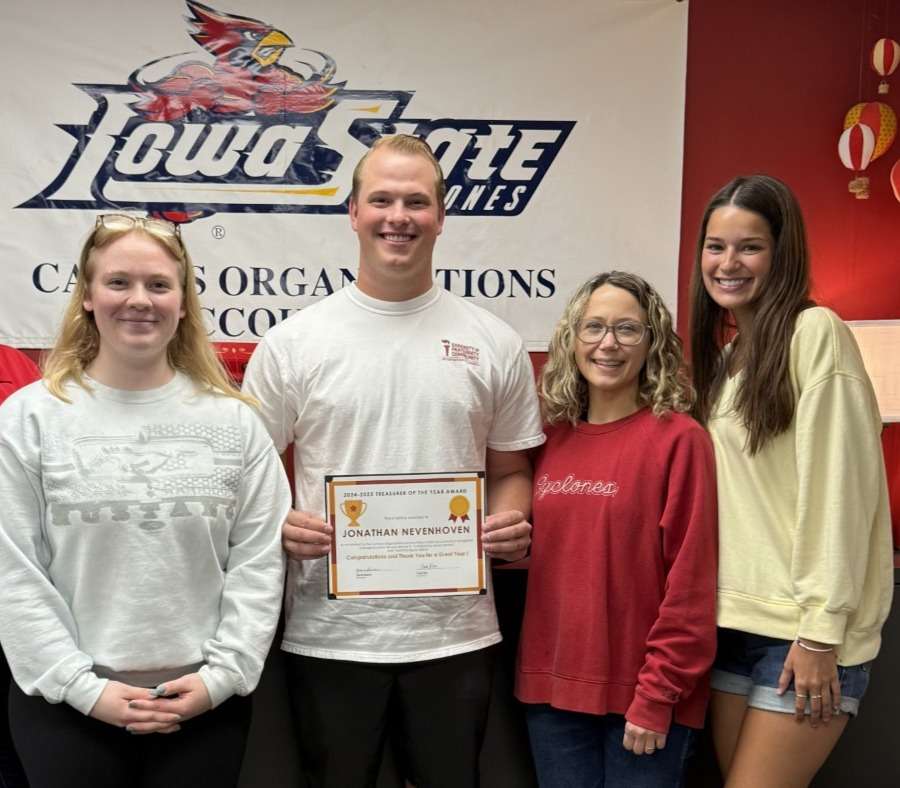 A group of 3 people with Jonathan Nevenhoven, Treasurer of the Year 2025, second from the left